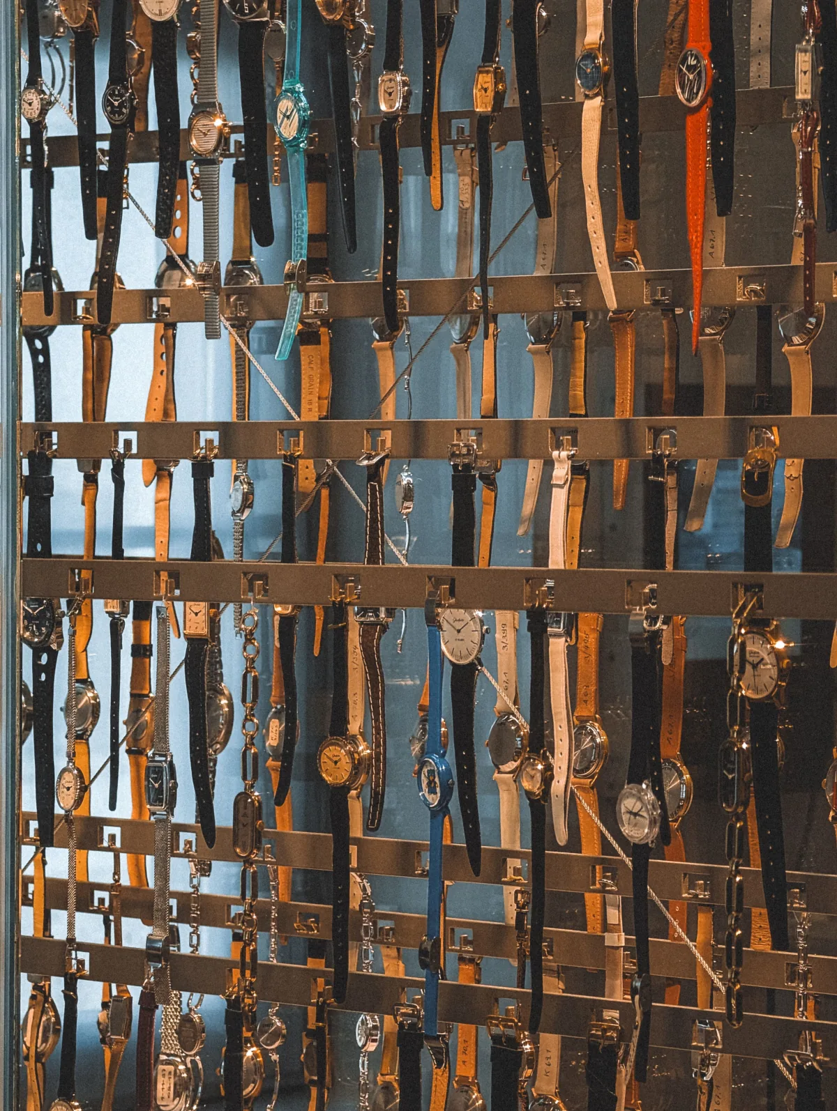 Luxury watches laid out on a wooden table